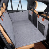 Quilted pet car seat cover protecting backseat and door panels in vehicle interior